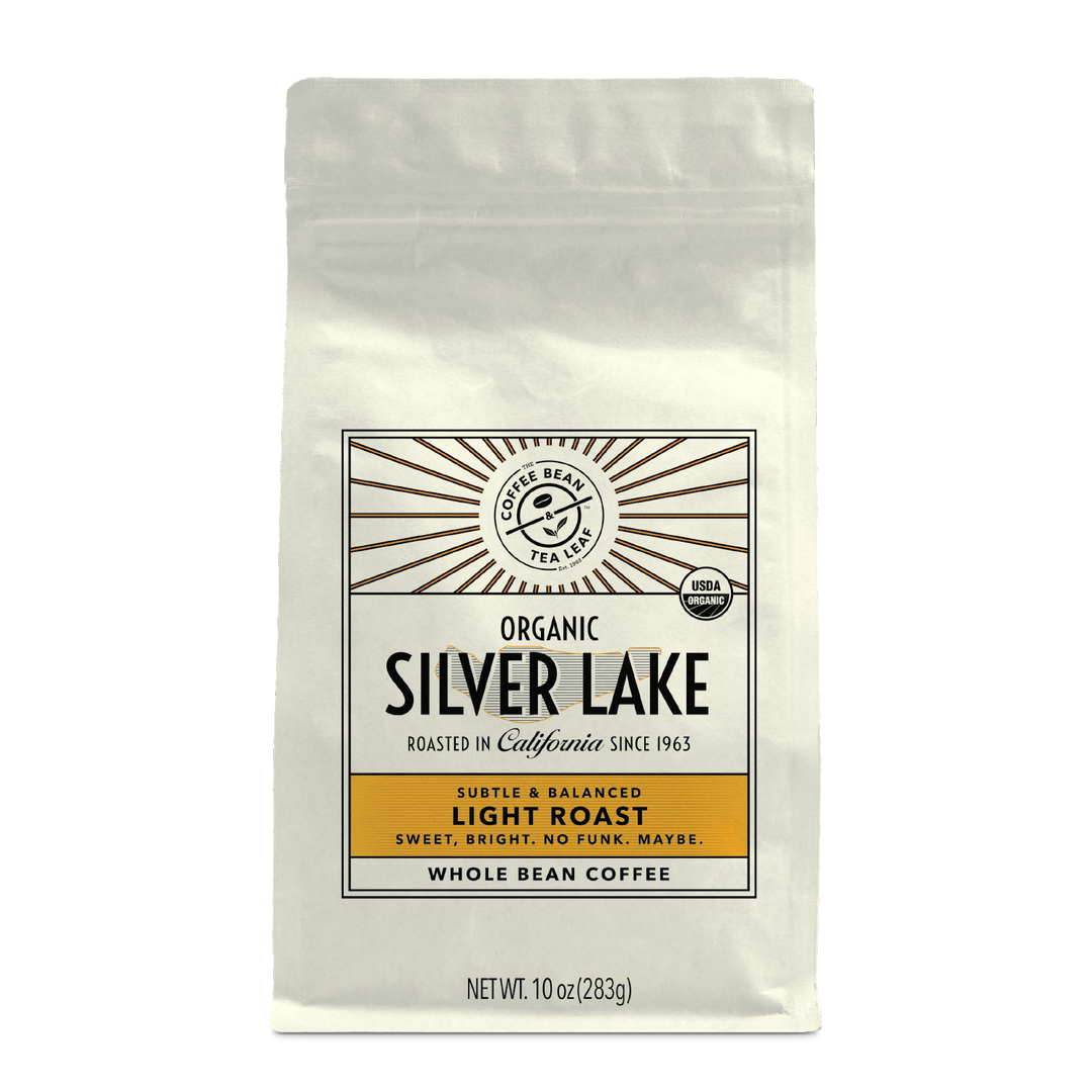 10oz cream bag labeled “Silver Lake” on a white background. The design shows the coffee is Roasted in California and has a Subtled & Balanced taste and is Light, Ground Coffee.