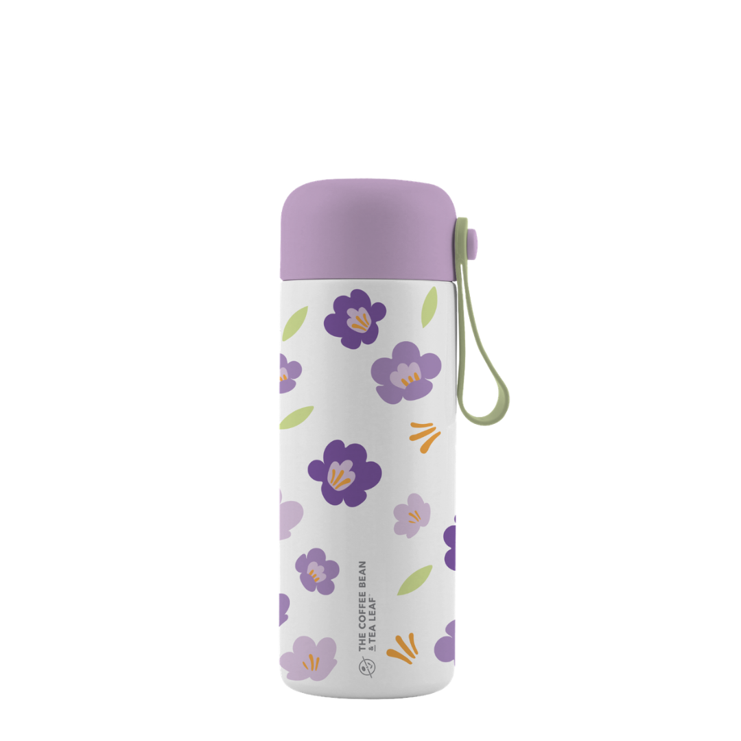 Floral-patterned water bottle with a purple lid on a white background