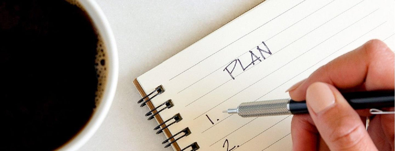 Cup of Coffee and Planning Notebook
