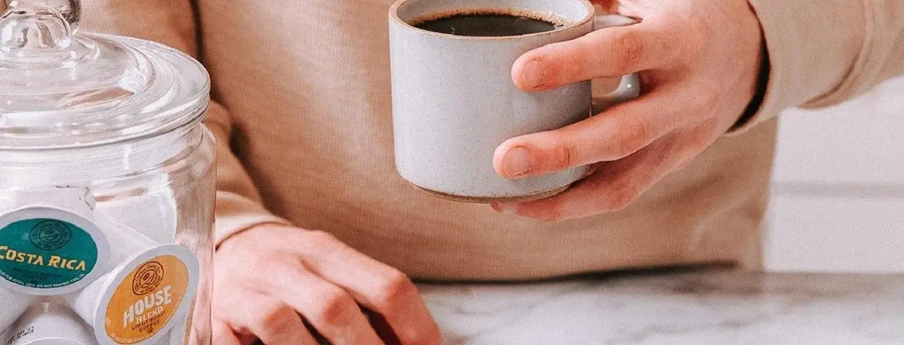 Person holding coffee mug