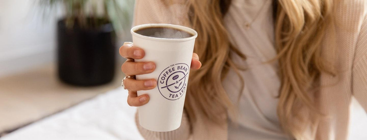 Woman Holding Cup of Coffee