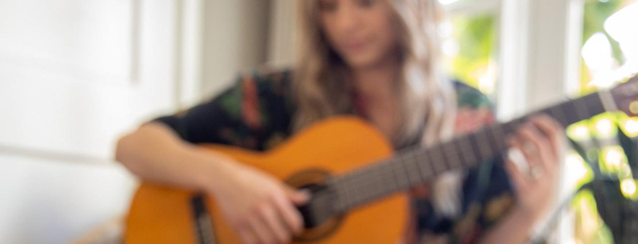 Woman Playing Guitar