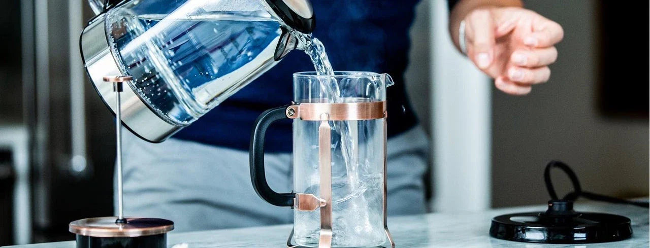 Man Pouring Water into Mug
