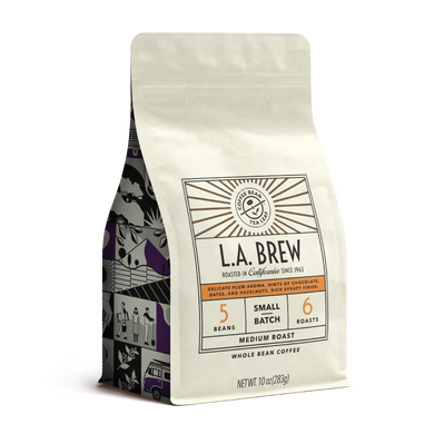 10oz cream bag labeled “L.A. Brew” on a white background. The design shows the coffee is Roasted in California, has a delicate plum aroma with hints of chocolate dates and hazelnut with a rich syrupy finish and is Medium, Ground.