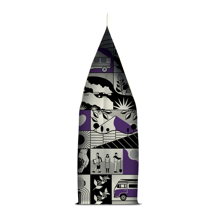 Side of coffee packaging with decorative design showing city skylines, buses and plants
