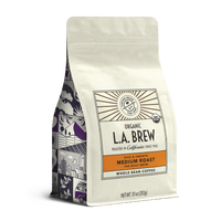 10oz cream bag labeled “L.A. Brew” on a white background. The design shows the coffee is Roasted in California and has a Rich & Smooth taste and is Medium, Ground Coffee.