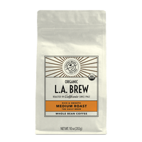 10oz cream bag labeled “L.A. Brew” on a white background. The design shows the coffee is Roasted in California and has a Rich & Smooth taste and is Medium, Ground Coffee.