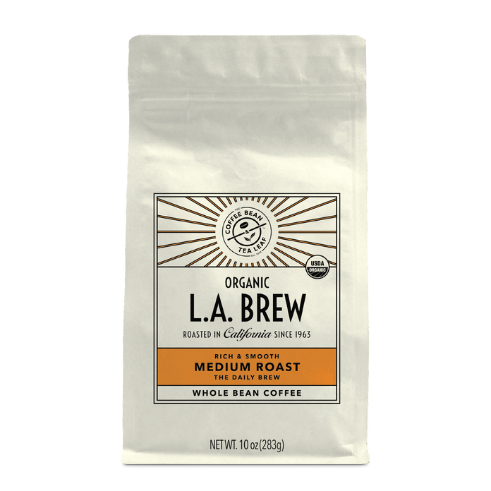 10oz cream bag labeled “L.A. Brew” on a white background. The design shows the coffee is Roasted in California and has a Rich & Smooth taste and is Medium, Ground Coffee.