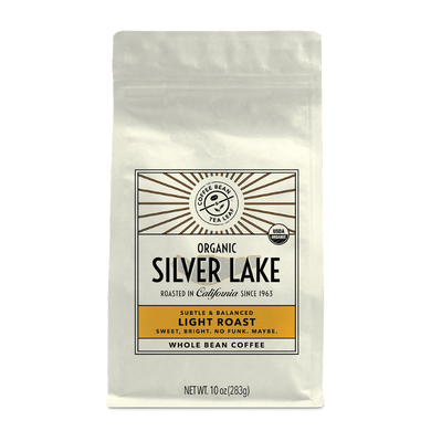 10oz cream bag labeled “Silver Lake” on a white background. The design shows the coffee is Roasted in California and has a Subtled & Balanced taste and is Light, Ground Coffee.
