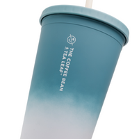 A teal and white gradient plastic travel tumbler with a matching lid and straw, featuring the vertical white text 'THE COFFEE BEAN & TEA LEAF' and logo on the side, set against a plain white background.