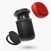 Aeropress coffee maker with red lid on a white background