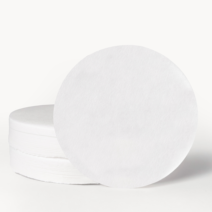 Stack of white plates on a light gray background