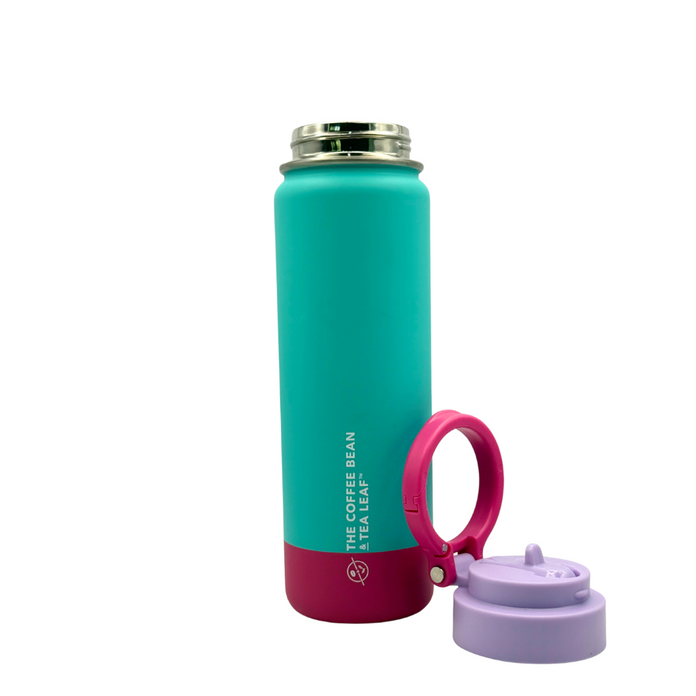 Turquoise and pink water bottle with a purple lid on a white background