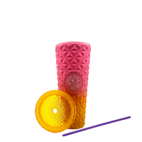 Pink textured tumbler with yellow lid and purple straw on a white background