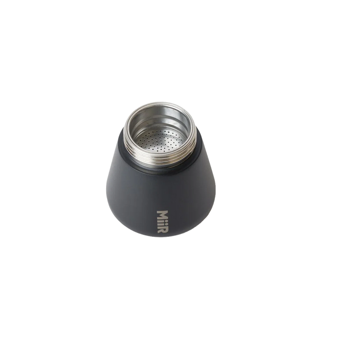 Black MiiR coffee percolator opened to show filter on a white background