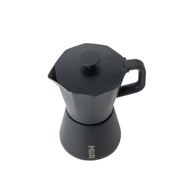 Topdown view of Black MiiR coffee percolator on a white background wiht "MiiR" printed on center bottom
