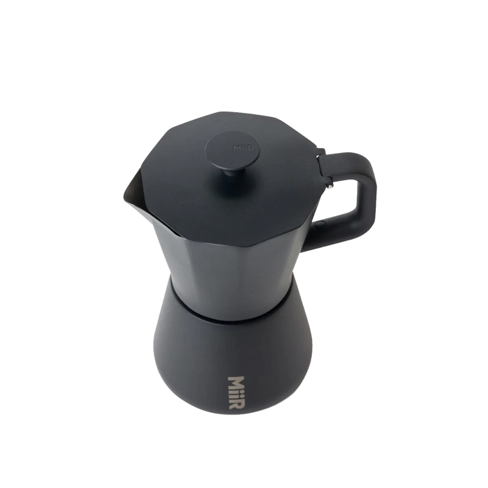 Topdown view of Black MiiR coffee percolator on a white background wiht "MiiR" printed on center bottom