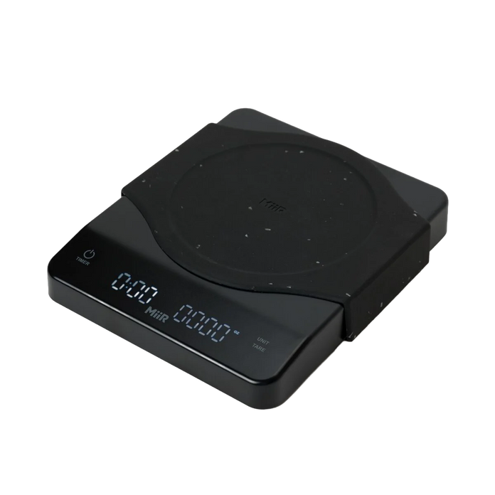 Black electronic scale with rubber surface and digital display on a white background