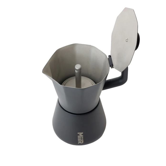 Gray coffee maker with a lid on a white background