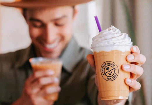 Man Holding Blended Drink
