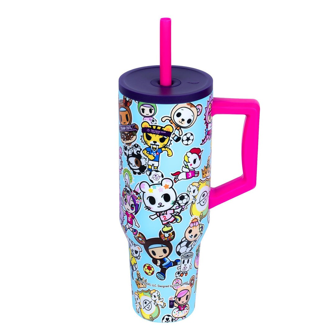 Colorful tumbler with cartoon character design on a white background