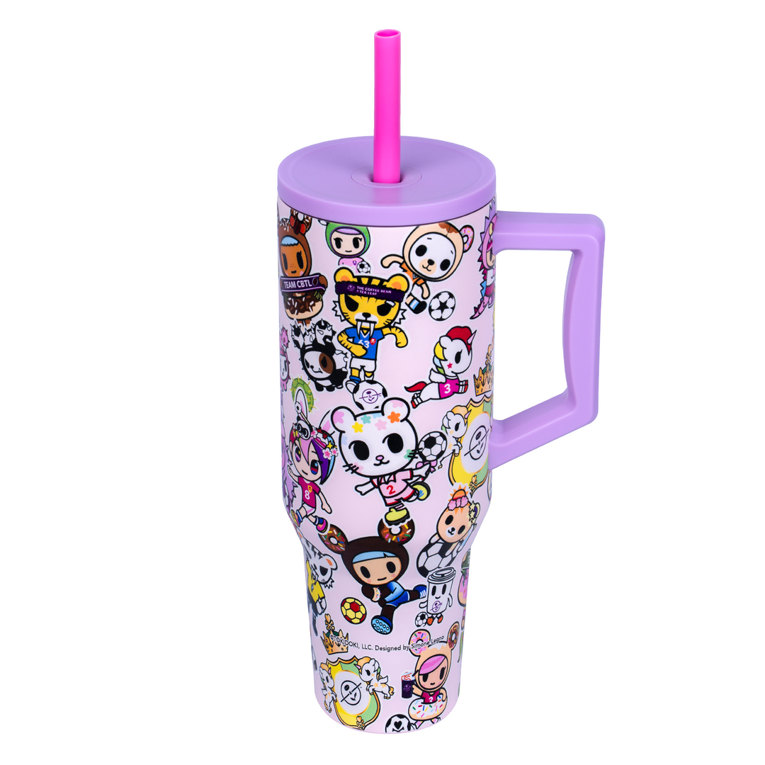 Tumbler with cartoon character design and purple handle on a white background