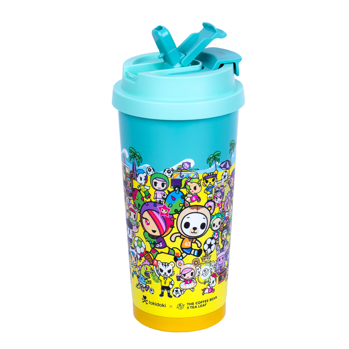 Blue tokidoki tumbler with flip lid, shows animated tokidoki characters on a beach