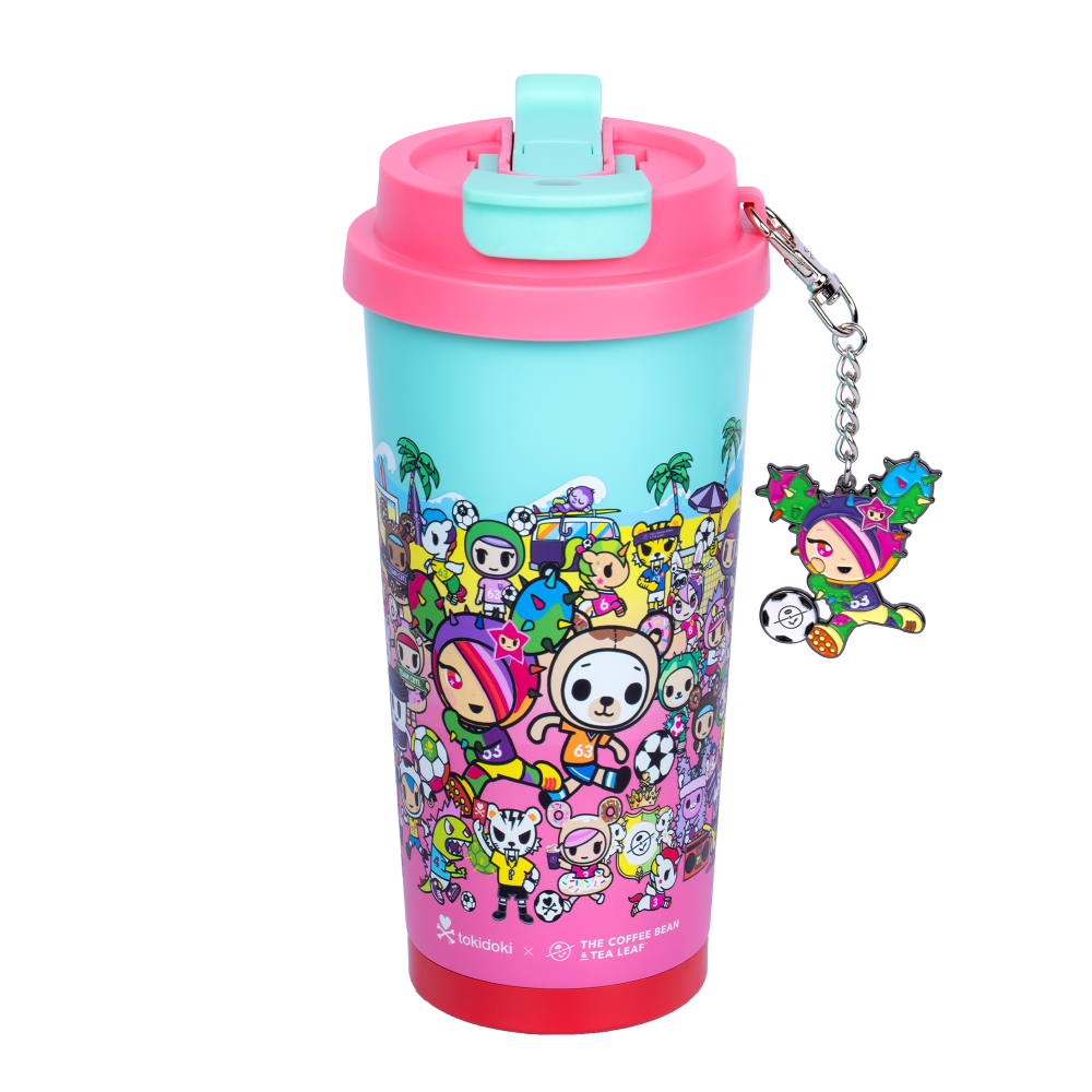 Pink tokidoki tumbler with flip lid, shows animated tokidoki characters on a beach