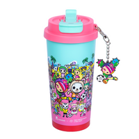 Pink tokidoki tumbler with flip lid, shows animated tokidoki characters on a beach
