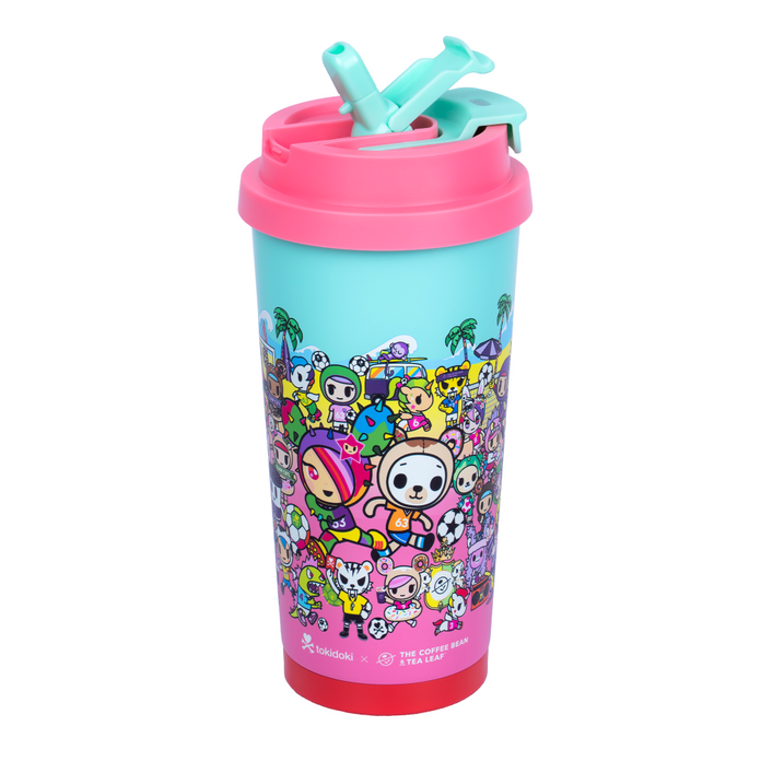 Pink tokidoki tumbler with flip lid, shows animated tokidoki characters on a beach